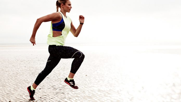 sweaty-betty woman running on beach